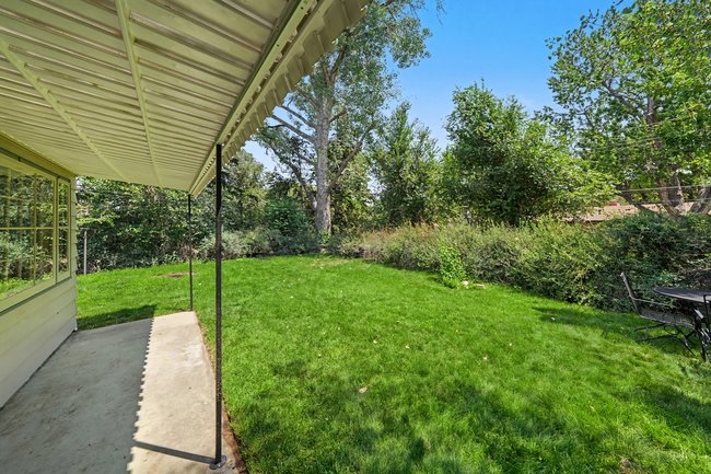 Covered rear patio and lawn
