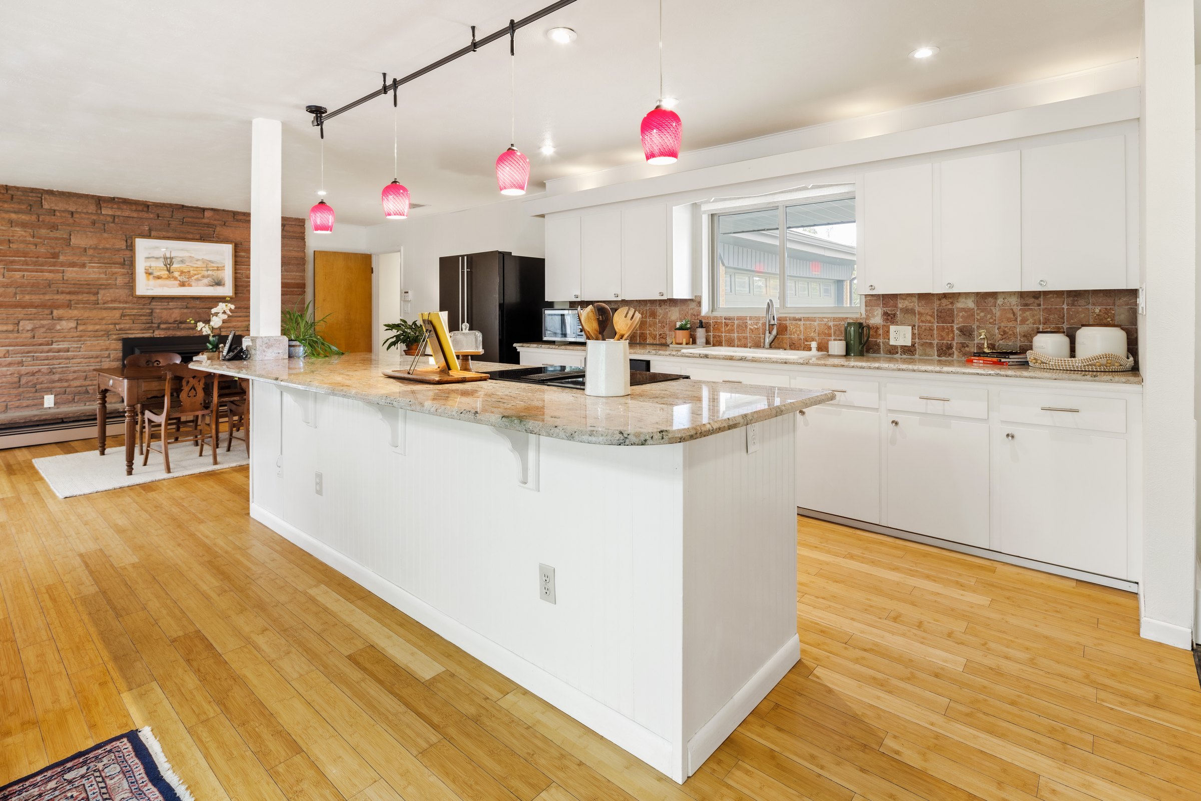 Kitchen island and white cabinetry at 3110 Ward Ct