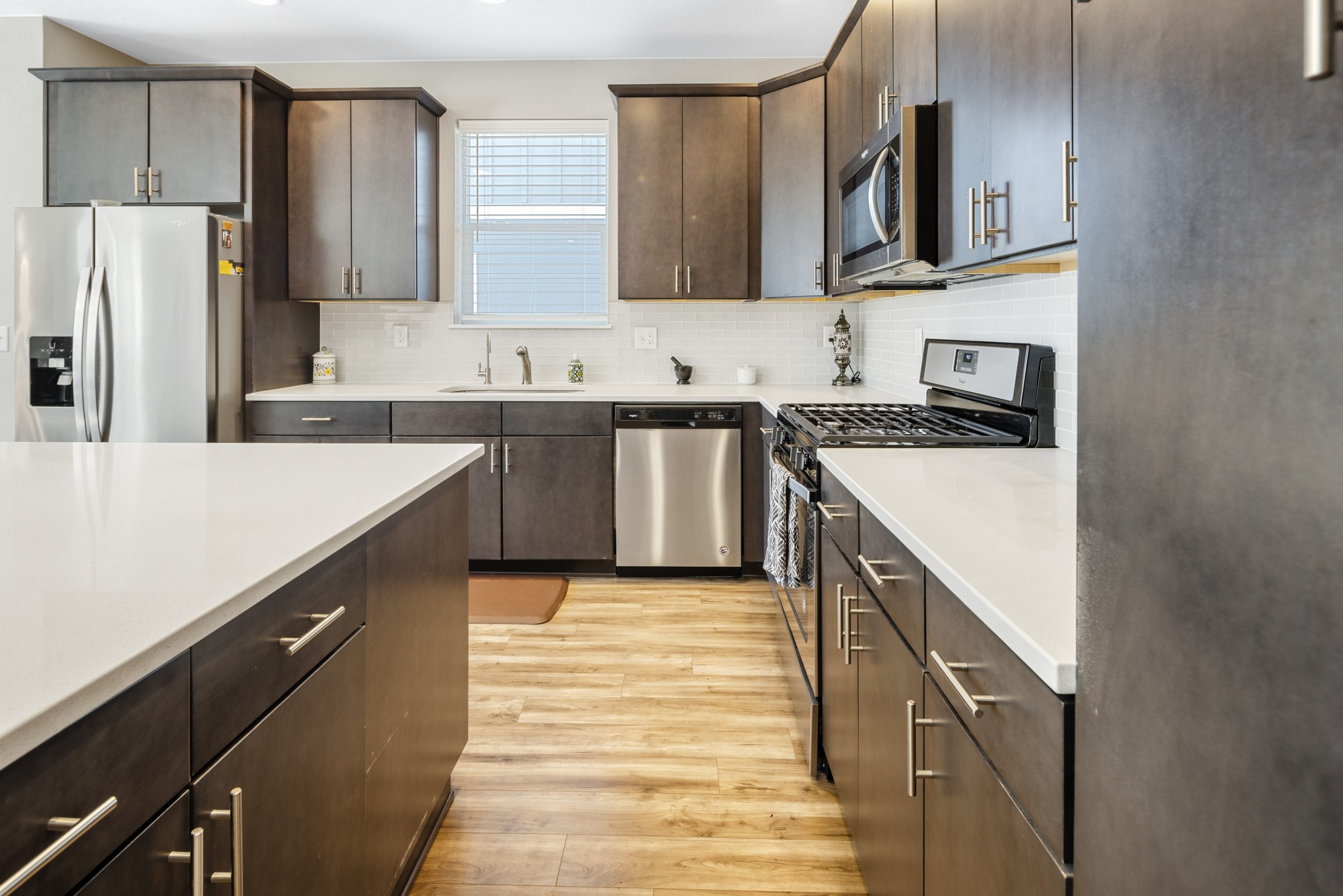 Kitchen work side with stainless appliances