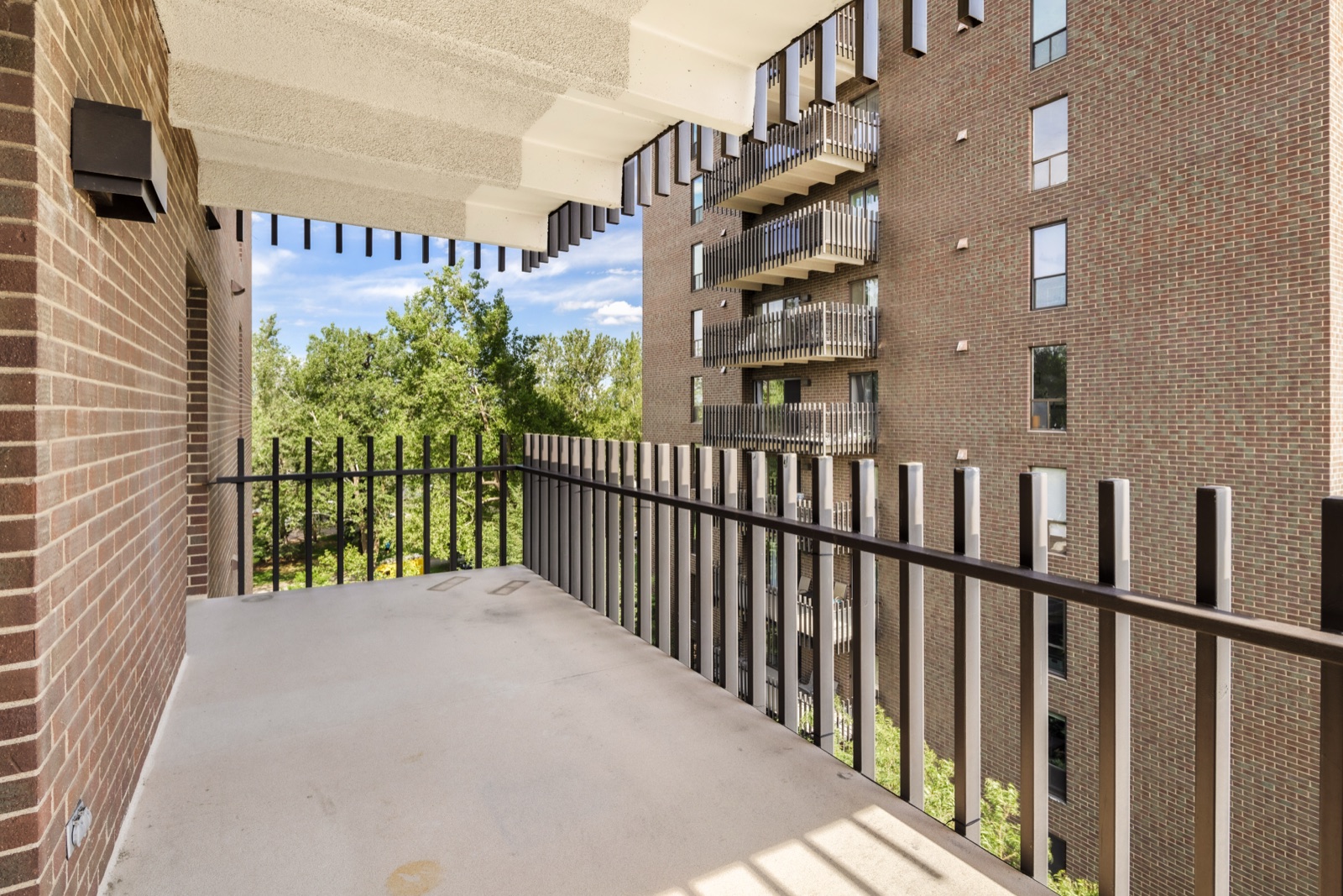 Full-width covered balcony at 480 S Marion #602A